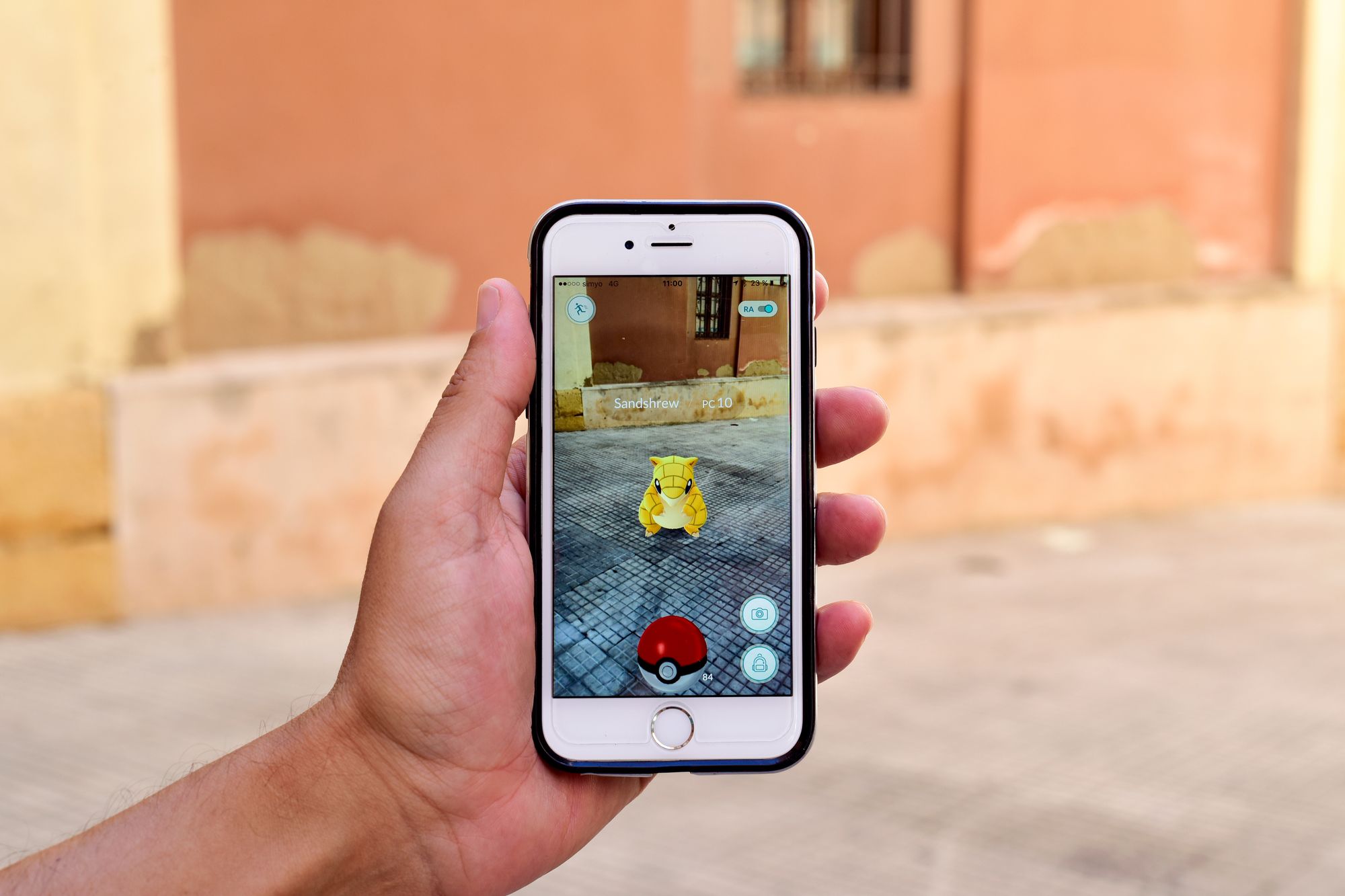 Pokémon Go! game on a smartphone; augmented reality superimposes virtual in-game elements over real world elements.